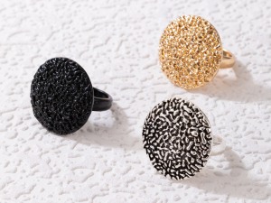 Set of Three Textured Statement Rings in Black, Gold, and Silver Tones